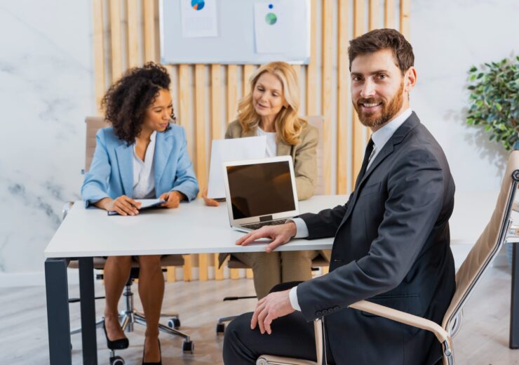 group-of-multiethnic-businesspeople-sitting-at-com-2023-11-27-05-15-06-utc-min